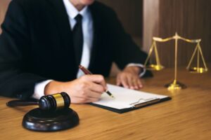 A lawyer working on a documents. Legal law, advice and justice concept.